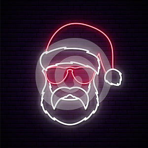 Santa Claus neon sign. Hipster man in Santa red hat.
