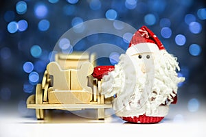 Santa Claus with old retro wooden car