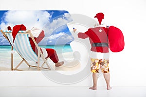 Santa claus painting vacation concept on wall