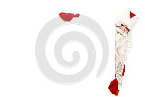 Santa Claus peeks out from behind a blank banner. Isolated over white background. Space for text