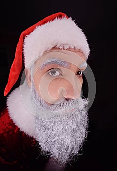 Santa claus peeks into the peephole