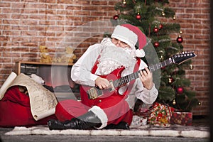 Santa Claus plays the guitar