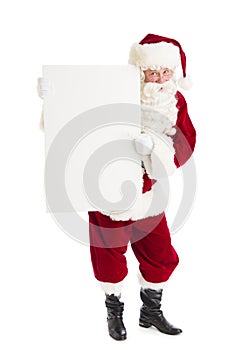 Santa Claus Pointing At Blank Billboard