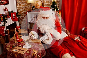 Santa Claus is preparing gifts for Christmas