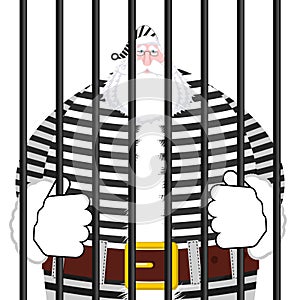 Santa Claus prison in striped robe. Window in prison with bars.