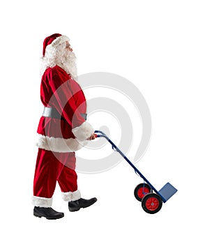 Santa claus pushes a trolley to carry parcels to deliver