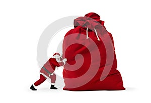 Santa Claus pushing huge bag of presents