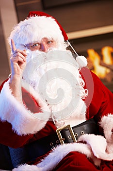 Santa Claus raising finger