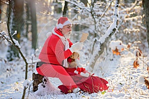 Santa Claus read Christmas wish list. Happy New Year.