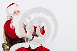 Santa Claus Reading Letter isolated over white baclground