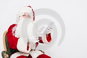 Santa Claus Reading Letter isolated over white baclground