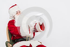 Santa Claus Reading Letter isolated over white baclground