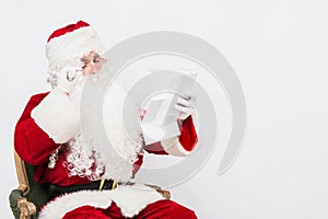 Santa Claus Reading Letter isolated over white baclground