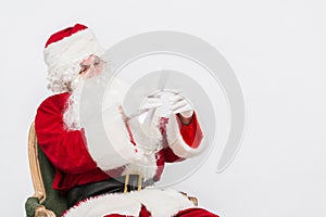 Santa Claus Reading Letter isolated over white baclground