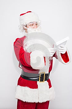 Santa Claus Reading Letter isolated over white baclground