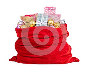 Santa Claus red bag full of Christmas boxes with gifts and toys, isolated on white background. File contains a path to isolation