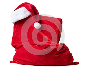 Santa Claus red bag with hat and gift box packed in red cloth, isolated on white background. File contains a path to isolation