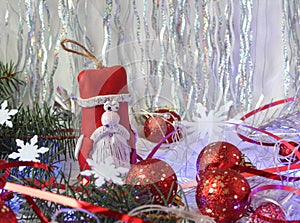 Santa Claus with red Christmas balloons and festive tinsel on a shiny background, close-up, space for text