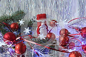 Santa Claus with red Christmas balloons and festive tinsel on a shiny background, side view