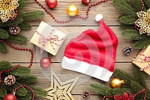 Santa Claus red hat and gifts on grey background. Christmas decoration