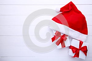 Santa Claus red hat and gifts on white background