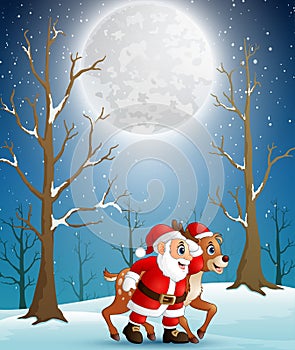 Santa claus with reindeer at christmas winter night