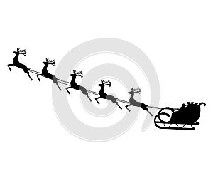 Santa Claus rides in a sleigh in harness on the reindeer