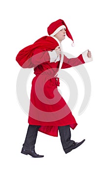 Santa Claus on the run to delivery christmas gifts and showing thumb