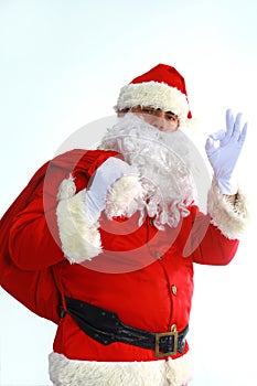 Santa Claus running with the bag of the presents