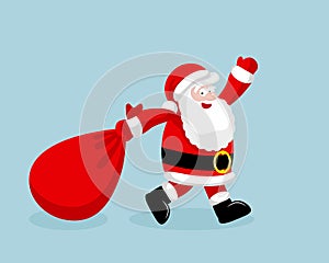Santa Claus running with the bag of the presents