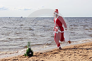Santa claus is running with gifts  delivery   vacation christmas new year