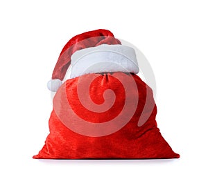 Santa Claus`s red hat and bag full, on white background. File contains a path to isolation.