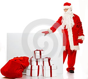 Santa Claus with sack full of gift boxes