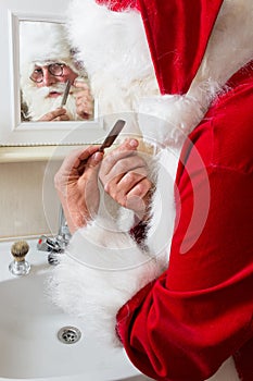 Santa claus is shaving