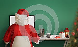 Santa Claus shopping online during the Christmas sale