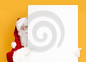 Santa Claus showing on white blank sheet of paper for greetings