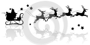 Santa Claus silhouette riding a sleigh with deers