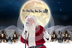 Santa claus singing christmas song in microphone