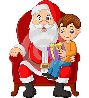 Santa Claus sitting in chair with a little cute boy