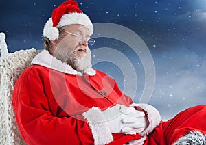 Santa claus sitting on chair and sleeping