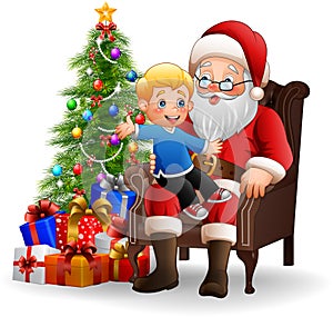 Santa Claus sitting with a little cute boy