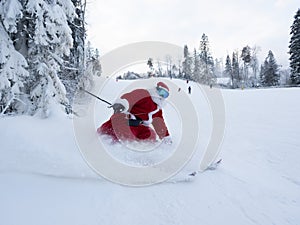 Santa Claus skiing downhill