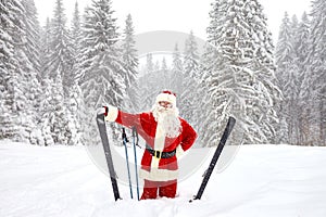 Santa Claus skiing in the mountains on snow in winter in Christm