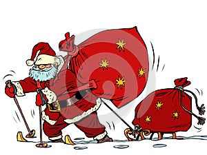 Santa Claus is skiing in the snow with a sled and gifts. Christmas and New Year. Winter seasonal holiday