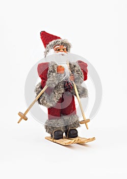 Santa Claus on skis tree a toy isolated