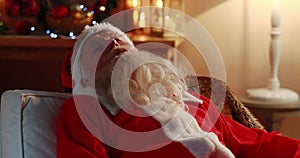 Santa claus sleeping in sofa