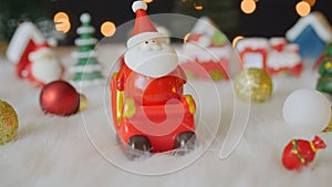 Santa claus on sleigh and christmas decorations with bokeh lights