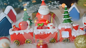 Santa claus on sleigh, christmas train and christmas decorations