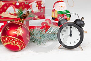 Santa claus sleigh, gift boxes, spruce branch, alarm clock and snowman on white background