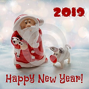 Santa Claus with a small pig - a symbol of 2019 with a congratulatory inscription